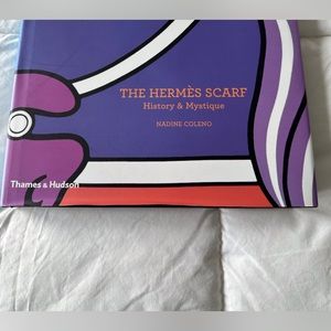 Hermes scarf coffee table book. Oranges and purple. High end and classy decor